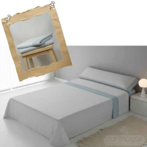 Cama vestida con sábanas de invierno de franela azul plomo y detalle del tejido de espiga